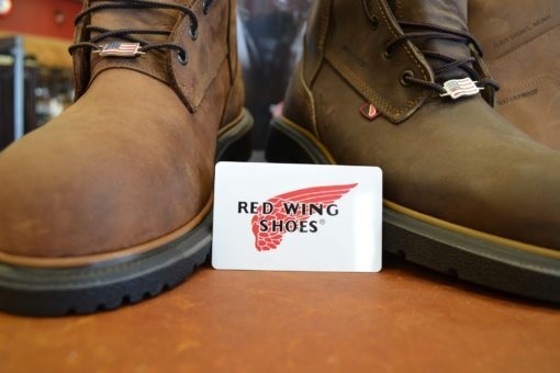 a picture of a red wing gift card in between two red wing boots